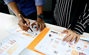 Two people working on a presentation