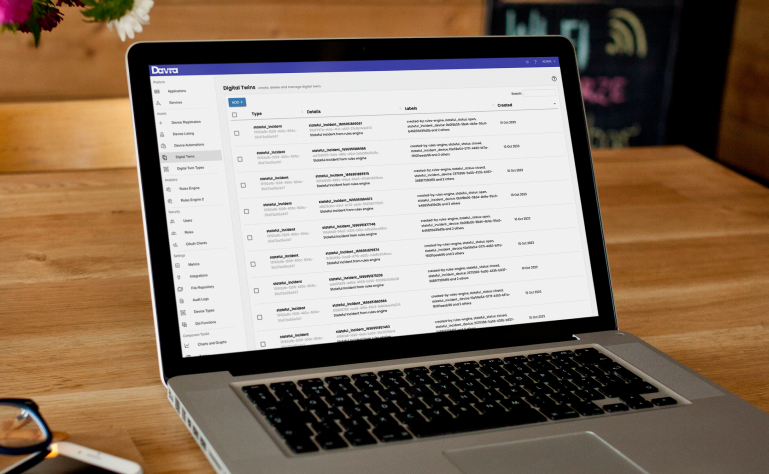 Laptop showing a table of digital twins on the Davra IIoT platform