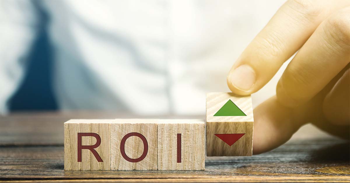 wooden blocks wiith letters on a desk spelling ROI